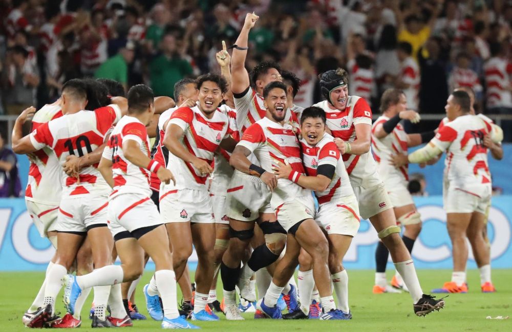 Japanese players celebrate their victory over Ireland at the 2019 Rugby World Cup