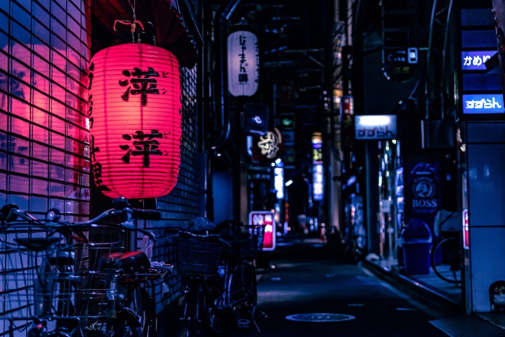 This nighttime street scene includes examples of all 3 types of Japanese characters.