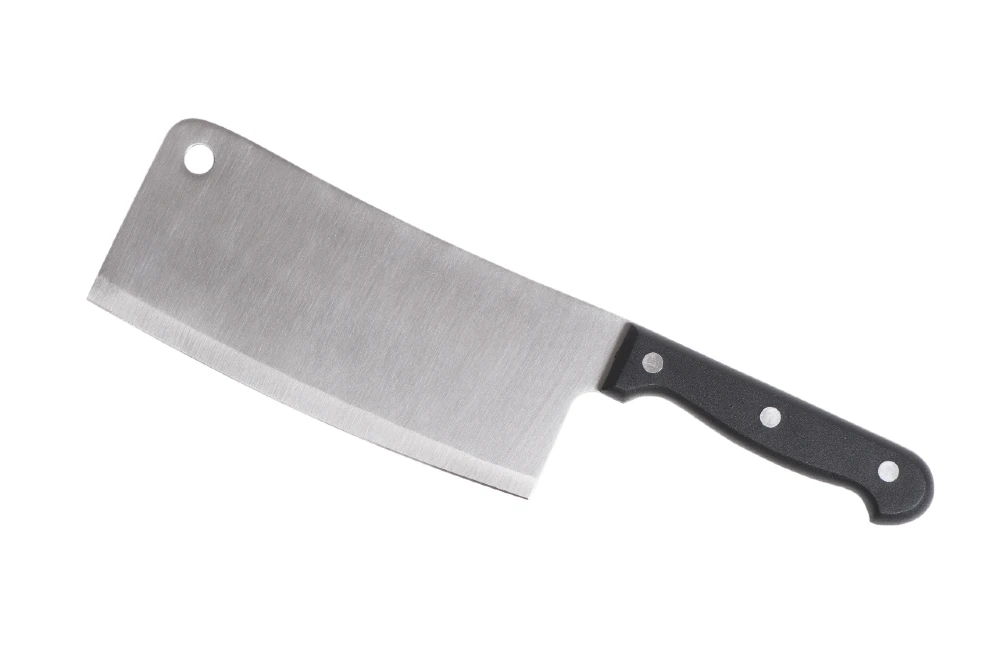 The cleaver's large, rectangular blade is designed to handle tough ingredients.